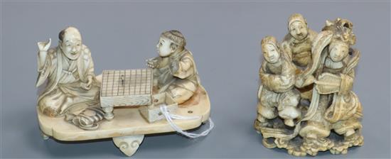 Two Japanese ivory okimono of go players and Benten with two attendants